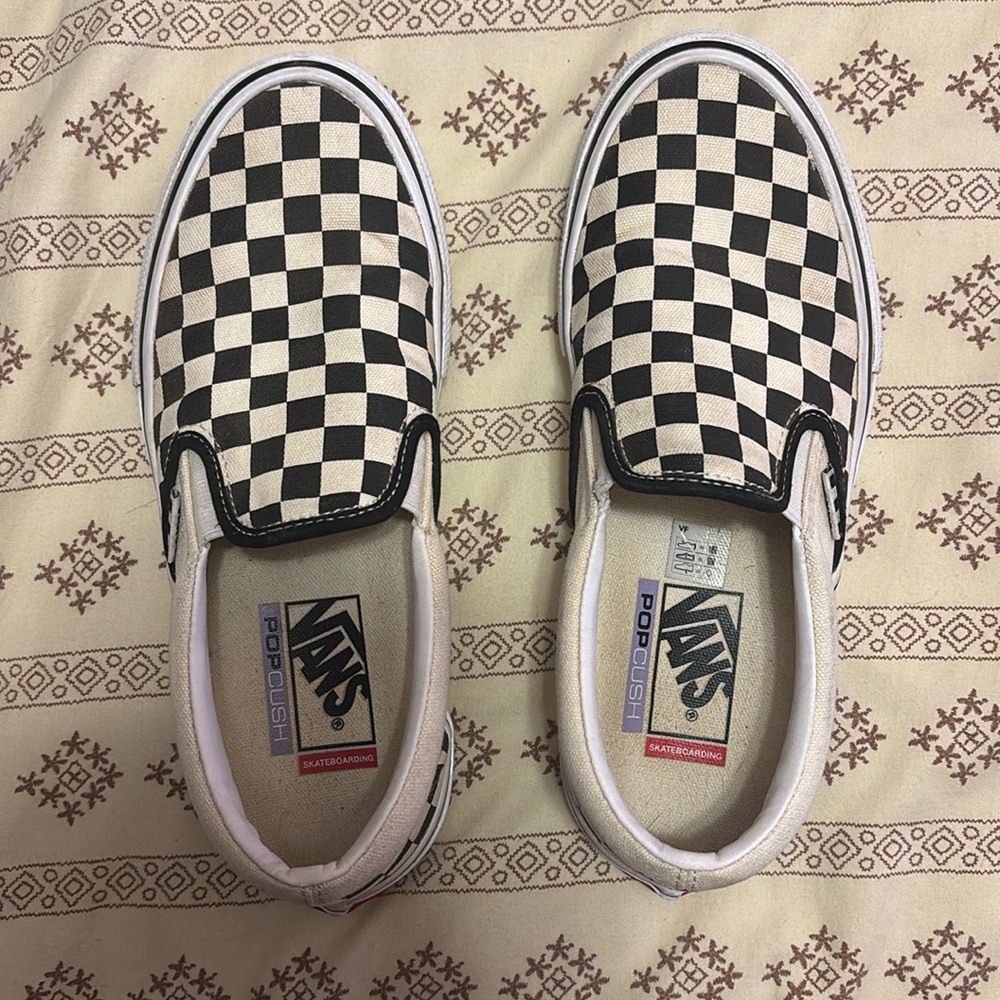 Vans black and white checkered slip ons